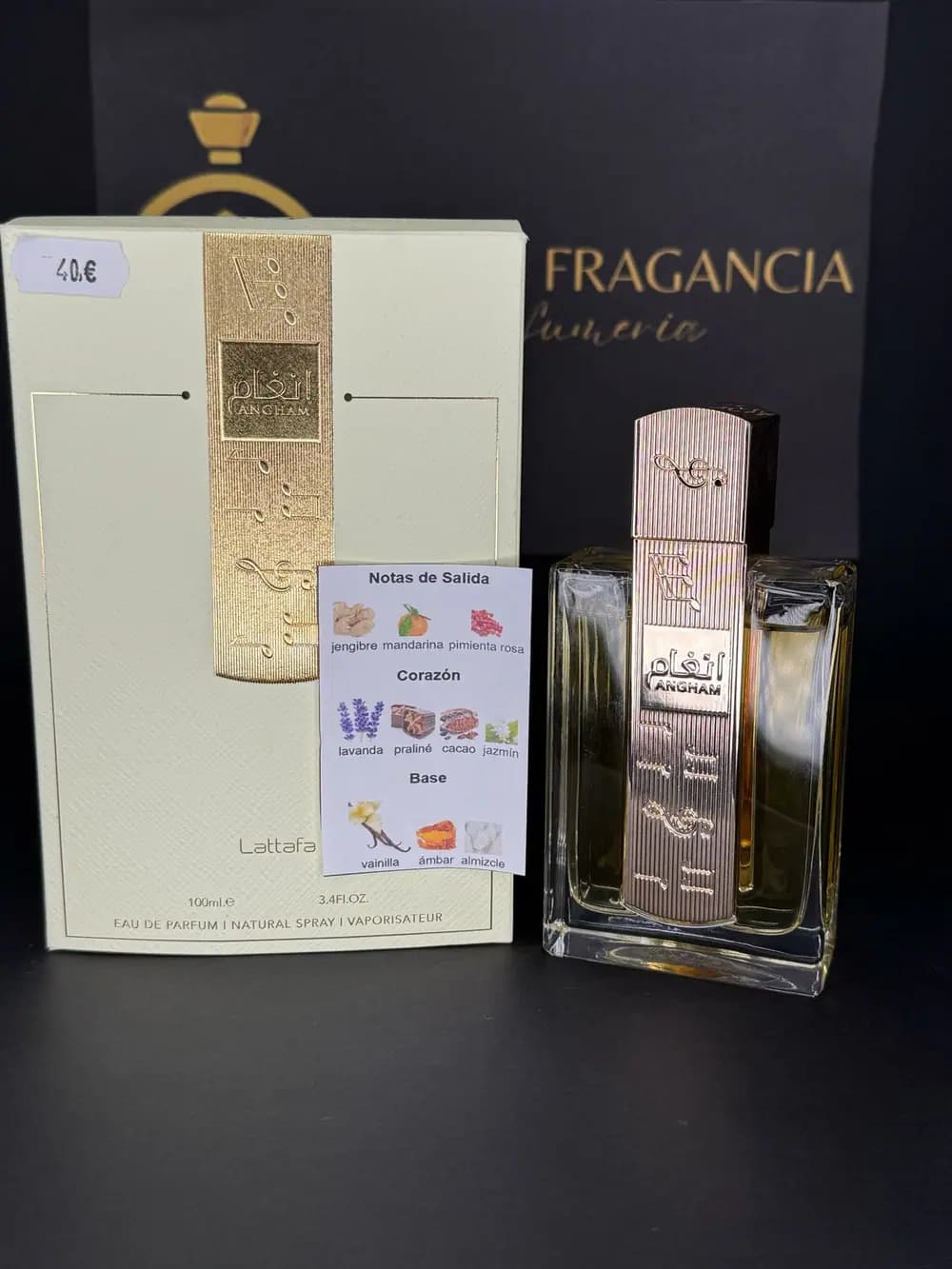 Angham de Lattafa, eau de parfum 100ml, junto a su estuche crema y dorado