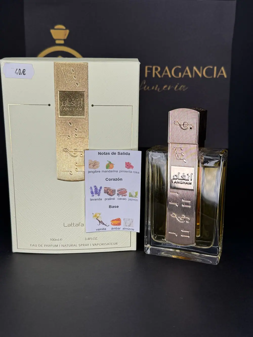 Angham de Lattafa, eau de parfum 100ml, junto a su estuche crema y dorado